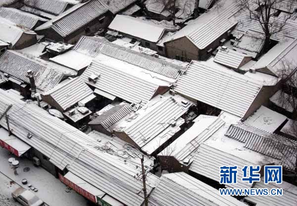 中国北方旱区雪花飘 北京降60年最晚初雪(组图)