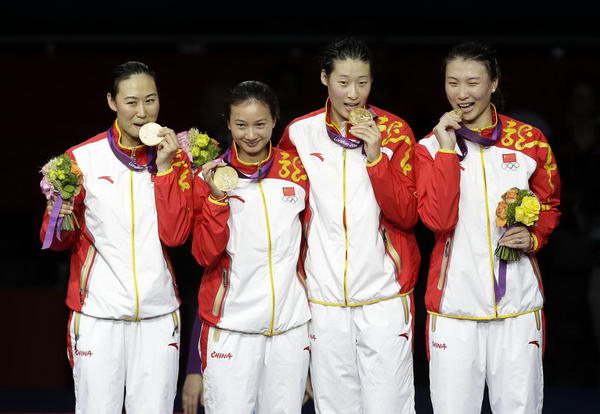 奥运图:中国女重创历史夺金 开心咬金