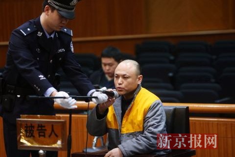2014年3月19日，被告人金巨阁在法庭上受审。张媛 文 王贵彬 摄