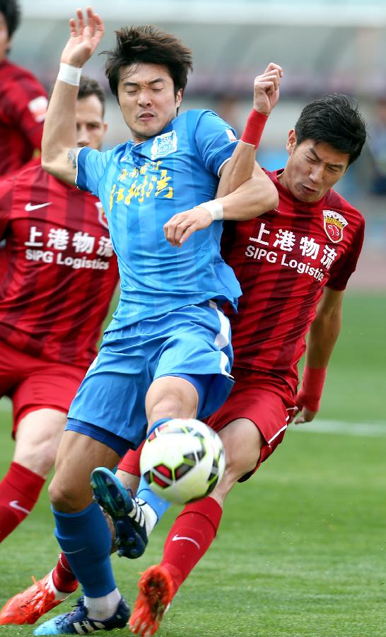 (体育)(7)足球--中超联赛:上海上港胜广州富力(图