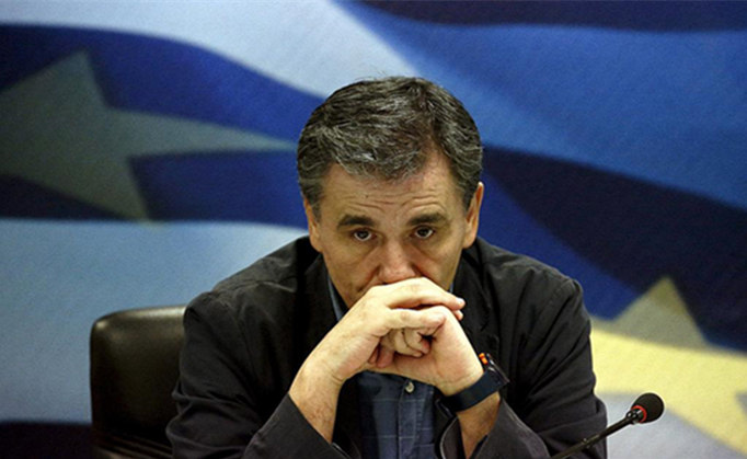 希腊危机:另一只靴子落地难(组图)