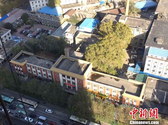 郑州藏身闹市61年文物楼面临拆迁 环保志愿者疾呼