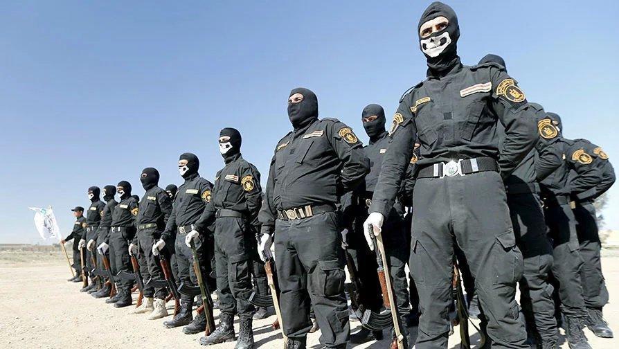 伊拉克特警阅兵蒙面行头唬人(组图)