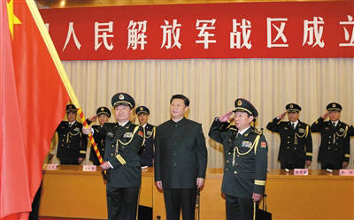 原文配图：习近平将军旗授予南部战区司令员王教成、政治委员魏亮。