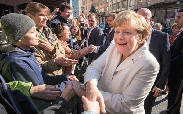 2015年10月，默克尔在德国法兰克福庆祝两德统一25周年 来源：英国《每日电讯》
