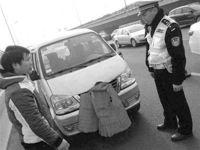 涉牌违法行为:司机用红外套遮挡号牌被罚