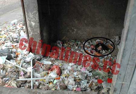 北京社区垃圾堆发现死婴 尸体脖子被刀割开(图)