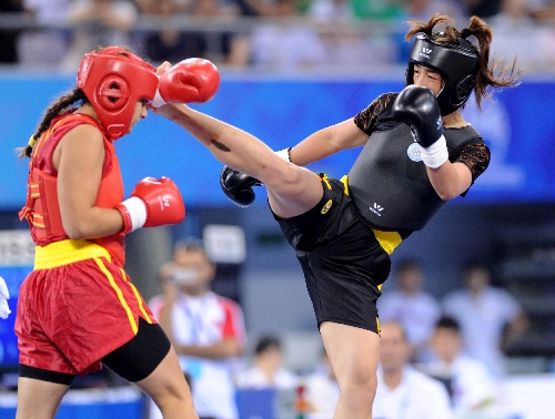 散打)女子52公斤級決賽中,中國選手鄂美蝶戰勝土耳其選手艾謝居爾