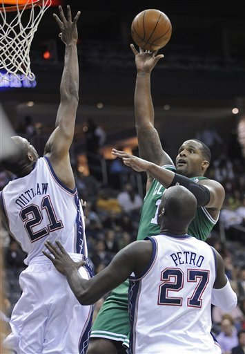 Boston Celtics Forward Glen Davis Puts Up A Shot Over New Jersey Nets Forward Travis Outlaw (21) And Johan Petro (27),