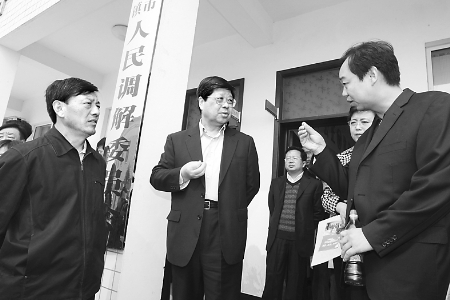 李新民基层调研民调工作