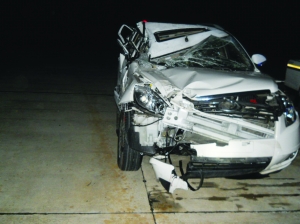 追尾事故发生后，丁某的小轿车严重变形 通讯员 供图