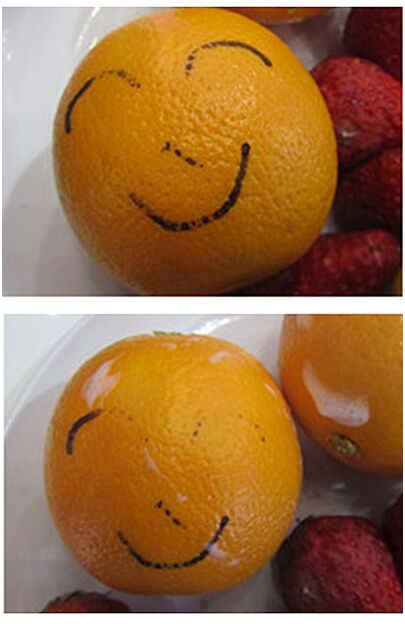 我用一个橙子来代替吧,用水彩笔画上笑脸,等笔迹完全干透之后,我用洁
